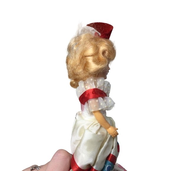 Vintage Collectible Doll With Blonde Hair wearing floral printed dress/red bow - Picture 6 of 8